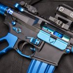 Custom AR rifle with black and blue accents, showcasing premium craftsmanship and unique design.