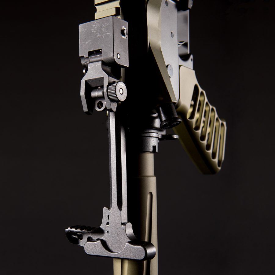 Close-up of firearm rear sight and tactical stock showcasing precision engineering and craftsmanship.