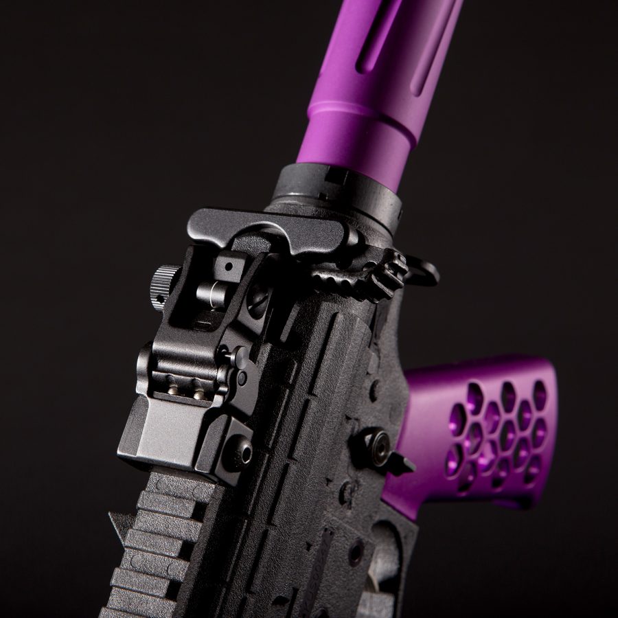 Custom AR rifle with black and purple accents showcasing premium craftsmanship and aesthetic appeal.