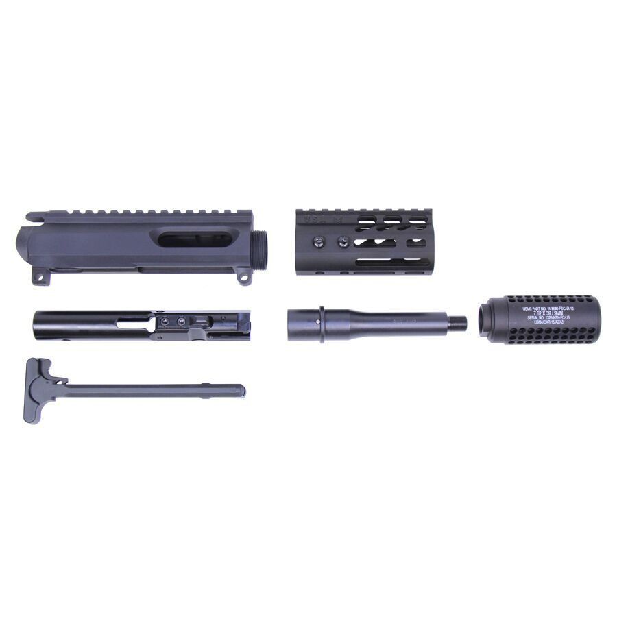 Disassembled AR-style upper receiver parts laid out on white background for display.