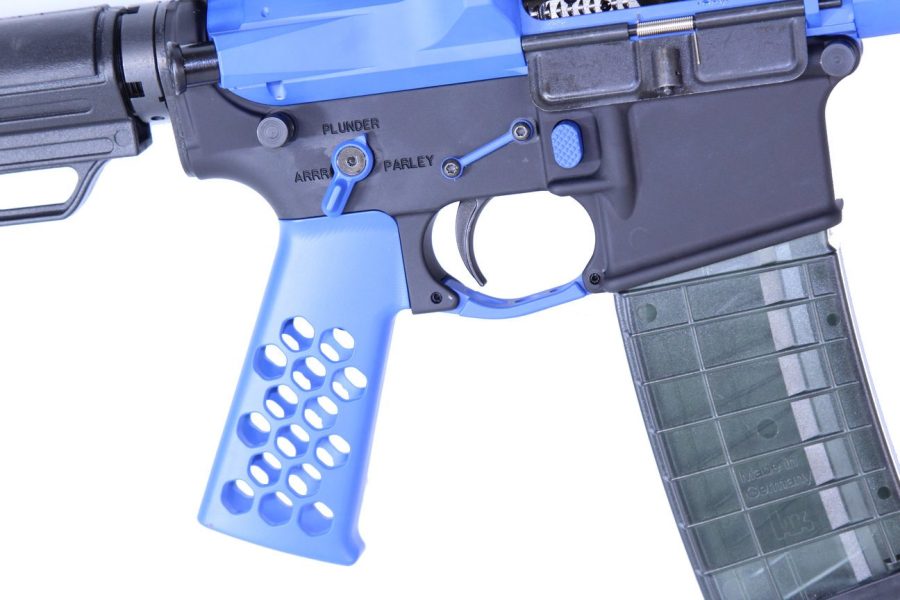Close-up of blue customized AR rifle with unique grip and transparent magazine.