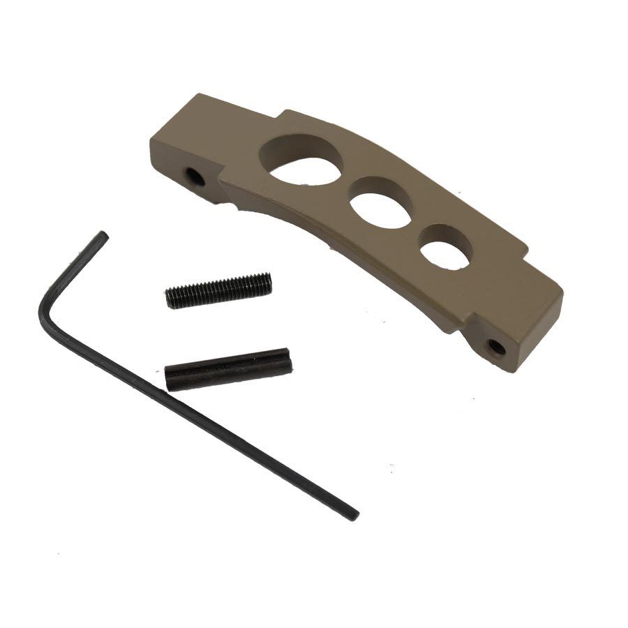 Tan trigger guard kit with hex key and screws, for firearm customization.