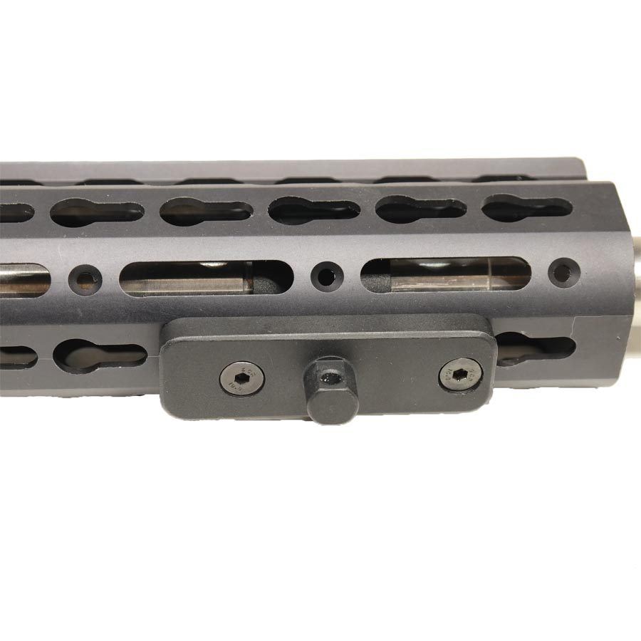 Close-up of anodized aluminum M-LOK handguard with cutouts for weight reduction and accessory attachment.