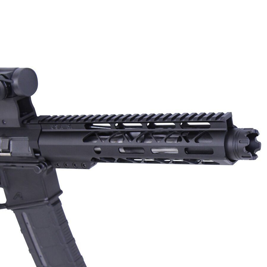 Close-up of black tactical rifle barrel with Picatinny rail and flash hider.