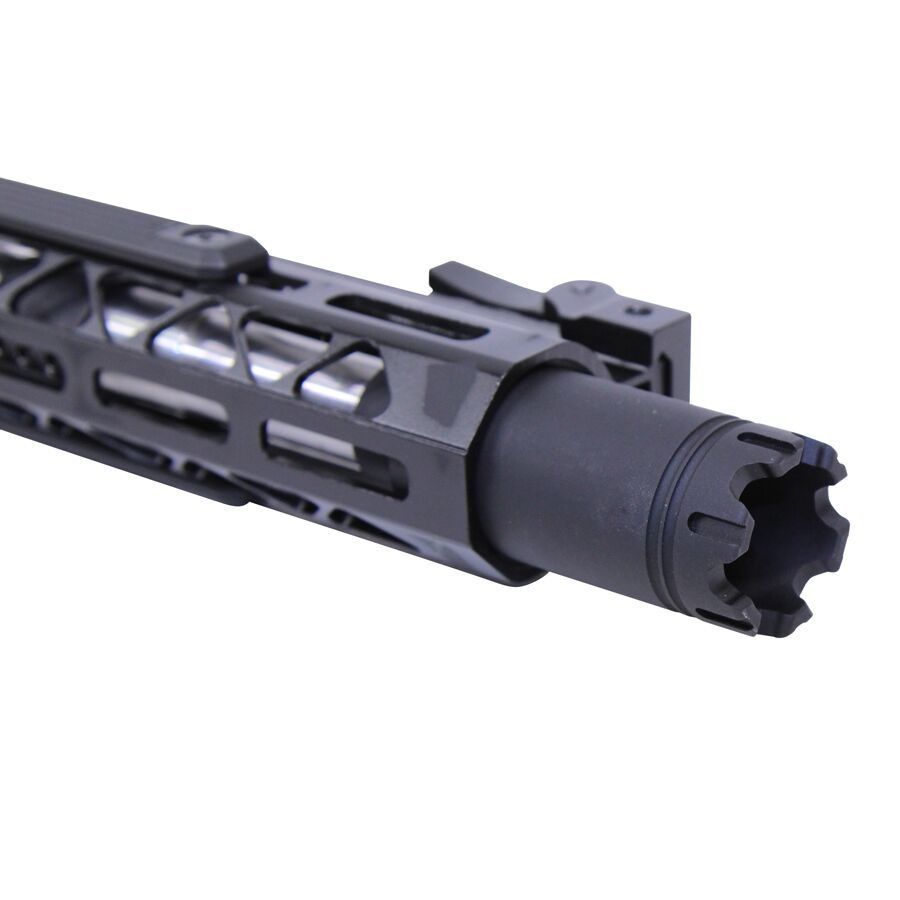 Close-up of a tactical firearm barrel with flash hider and M-LOK rail system.