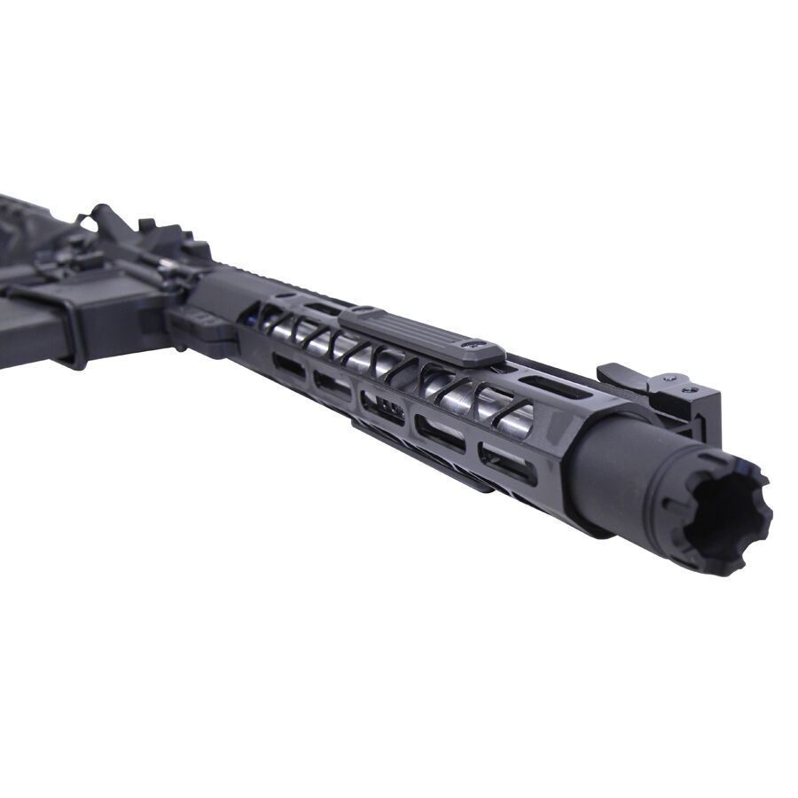 Close-up of modern tactical rifles barrel with M-LOK handguard and muzzle device.
