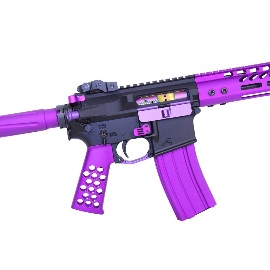 Custom purple AR-15 rifle with black upper, translucent magazine, railed handguard, textured grip.