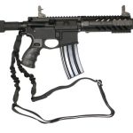 Compact AR-style rifle with suppressor, tactical rails, and sling for close-quarters operations.