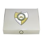 Elegant white gift box with shield logo, signifying tradition and quality.