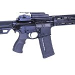 Close-up of black AR-15 style rifle with ergonomic grip, adjustable stock, and rail system.