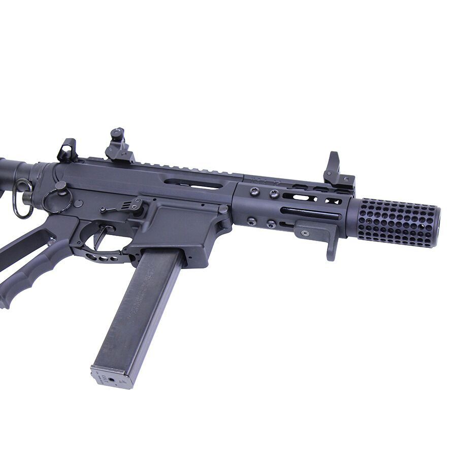 Matte black compact submachine gun, folding stock, suppressor, designed for tactical operations.