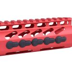 Red anodized firearm handguard with ventilation slots and Picatinny rail, featuring black attachment points.