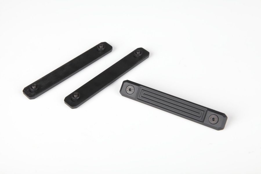 Black tactical rail sections for firearm accessories, featuring mounting holes; Picatinny or M-LOK type.