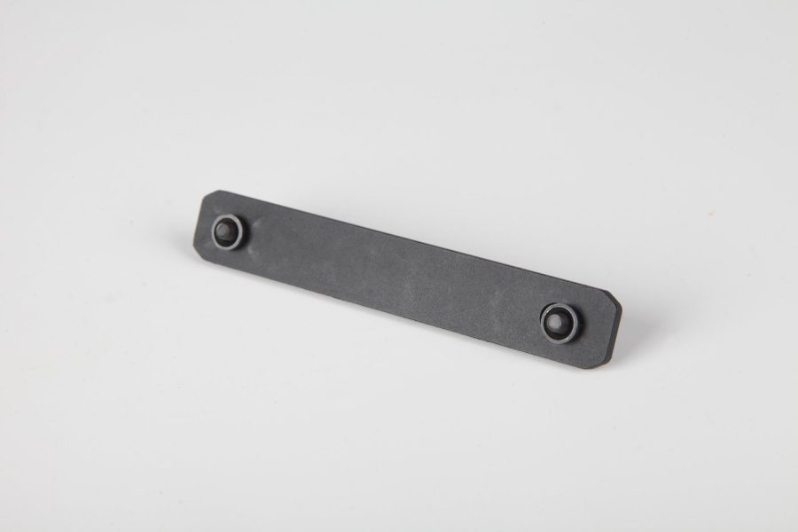 Industrial matte steel bar with rounded ends and circular mounting holes for assembly use.