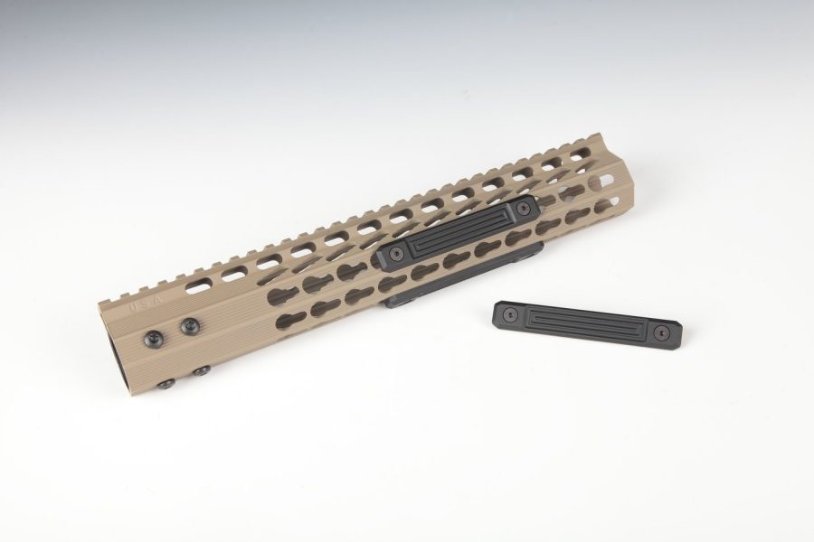 Tan AR-15 Keymod handguard with Picatinny rail and modular accessory slots for custom builds.