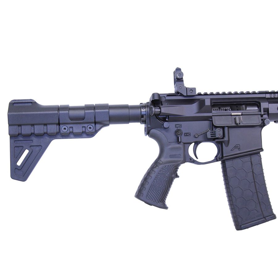 Compact black AR-15 style rifle with collapsible stock, pistol grip, and flip-up rear sight.