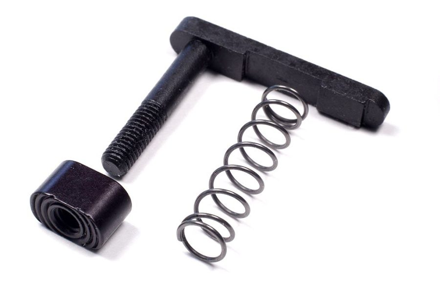 AR-15 charging handle assembly: T-shaped handle, recoil spring, and cylindrical pin components.