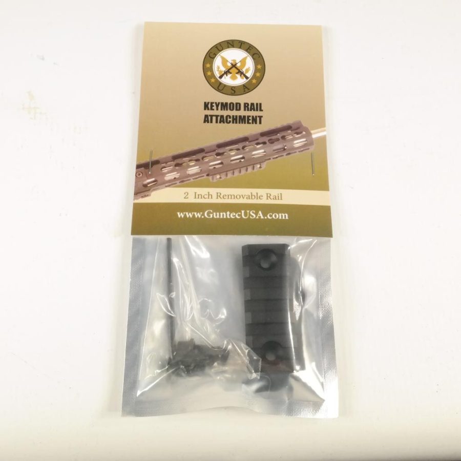 Packaged tactical keyring rail attachment by Diamaco USA, visible through clear packaging.
