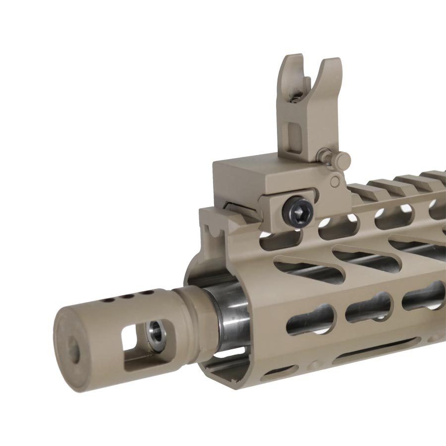 Close-up of tan tactical rifle handguard, muzzle device, and flip-up front sight.