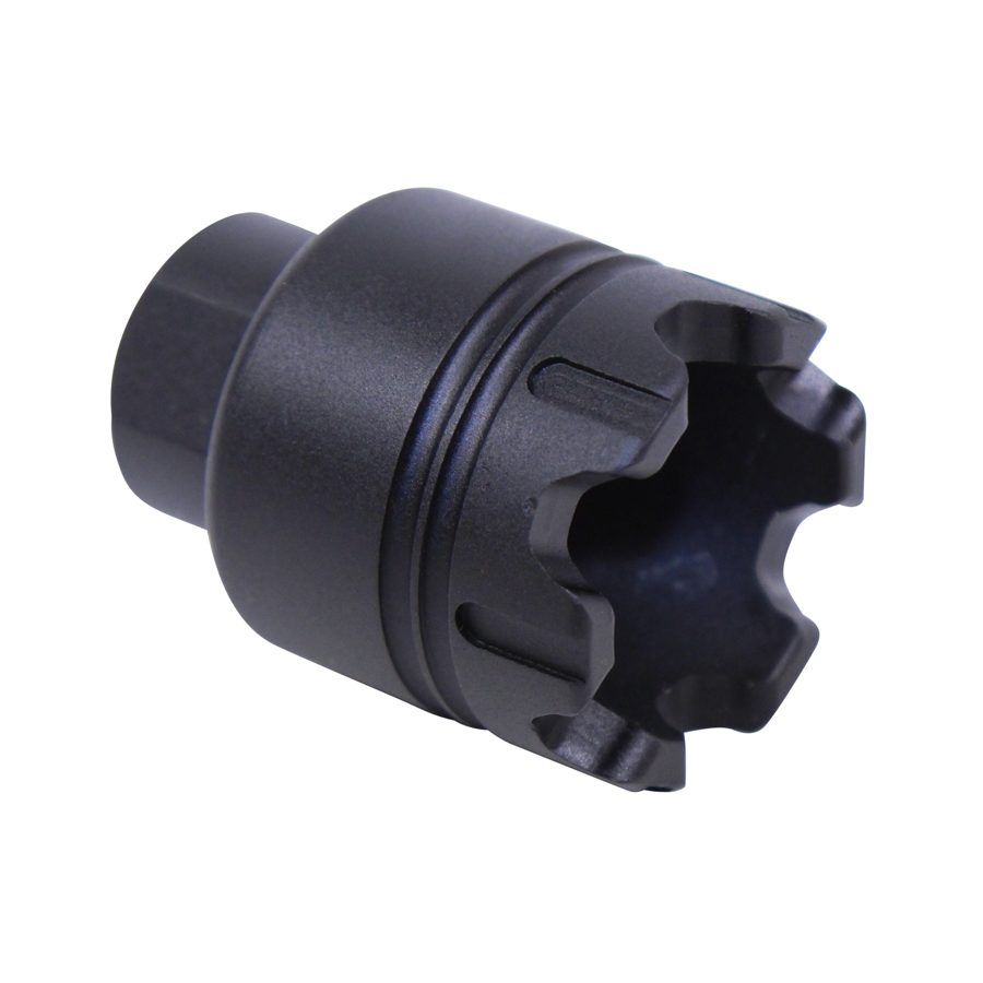 Black muzzle device with serrated crown for flash suppression, gas dispersion, and recoil reduction.