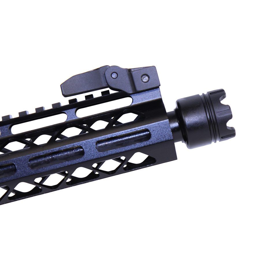 Close-up of tactical firearm barrel with honeycomb handguard, flash reducer, and customizable rail system.