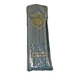 Protective sleeve with a gold emblem, collectible or ceremonial item inside.