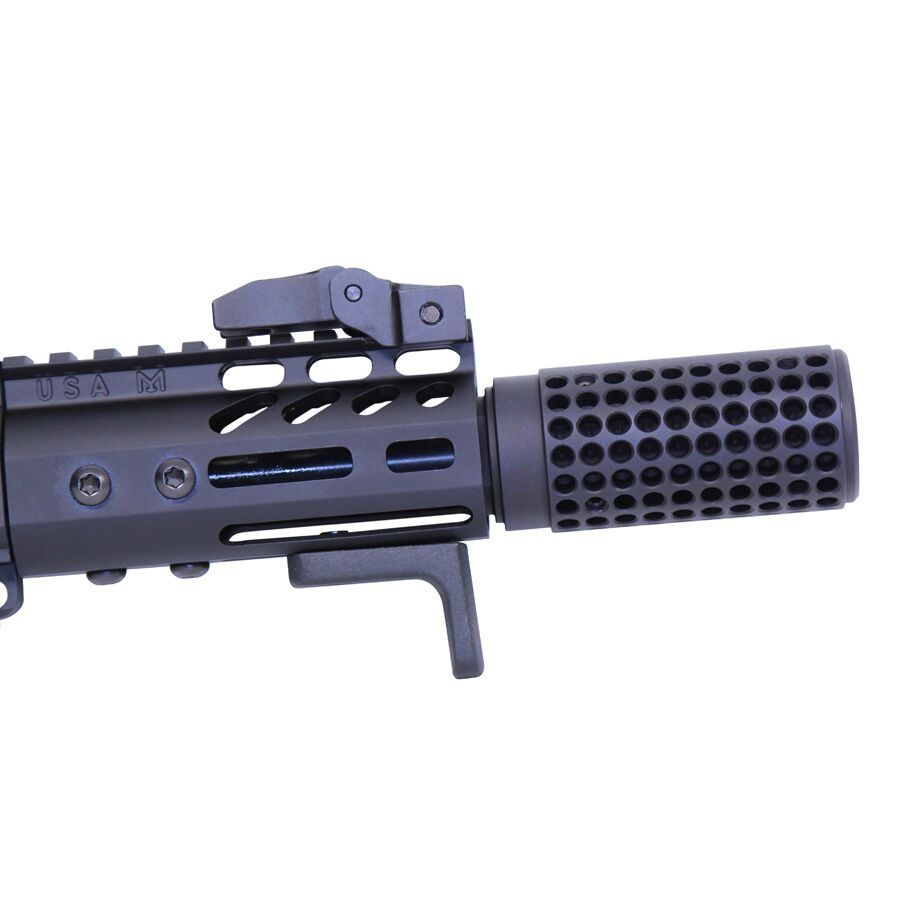 Close-up of tactical firearm muzzle device and handguard with ventilation cuts.
