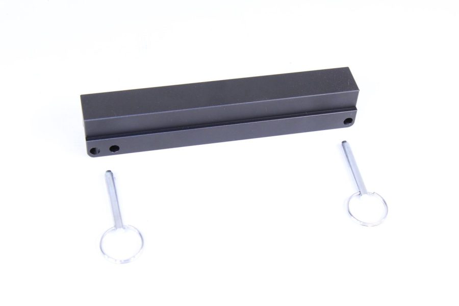 Sleek black device with white circular attachments, minimalist industrial design, modern accessory.
