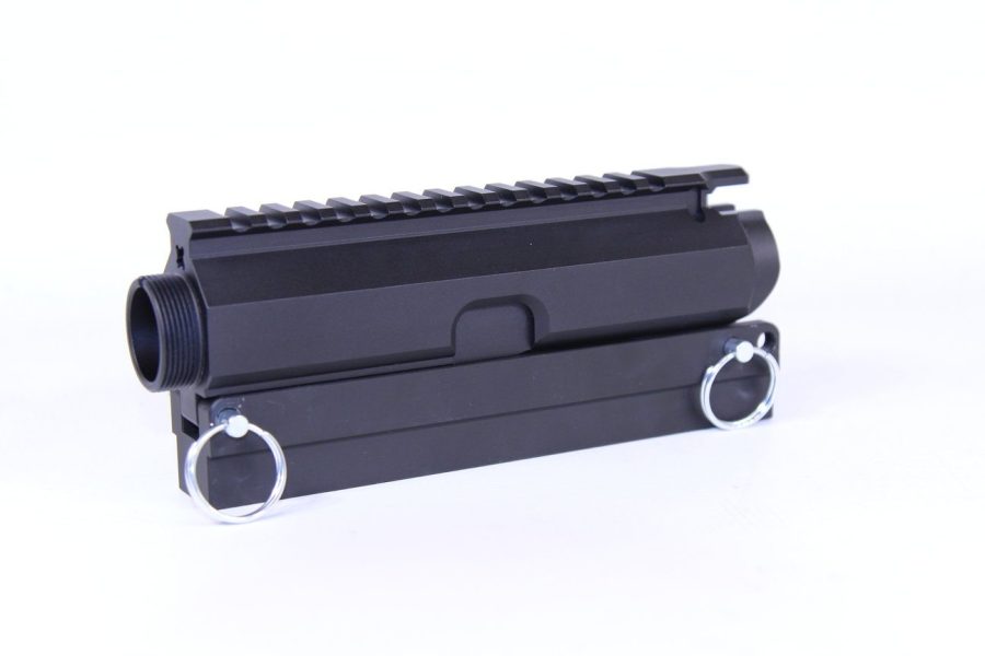 Matte black AR-15 upper receiver, Picatinny rail, silver ports, firearm assembly essential.