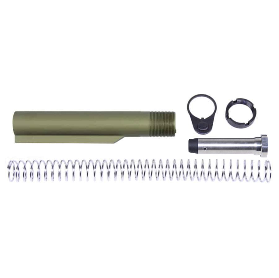 Disassembled AR-15 carbine buffer kit with olive drab tube, spring, buffer, nut, and plate.