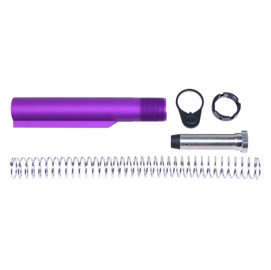 Disassembled purple AR-15 buffer tube assembly with stainless steel spring and essential parts.