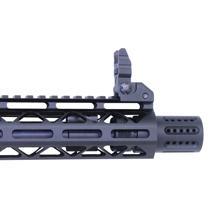 Close-up of modern firearm handguard with rail, flash hider, and front sight.