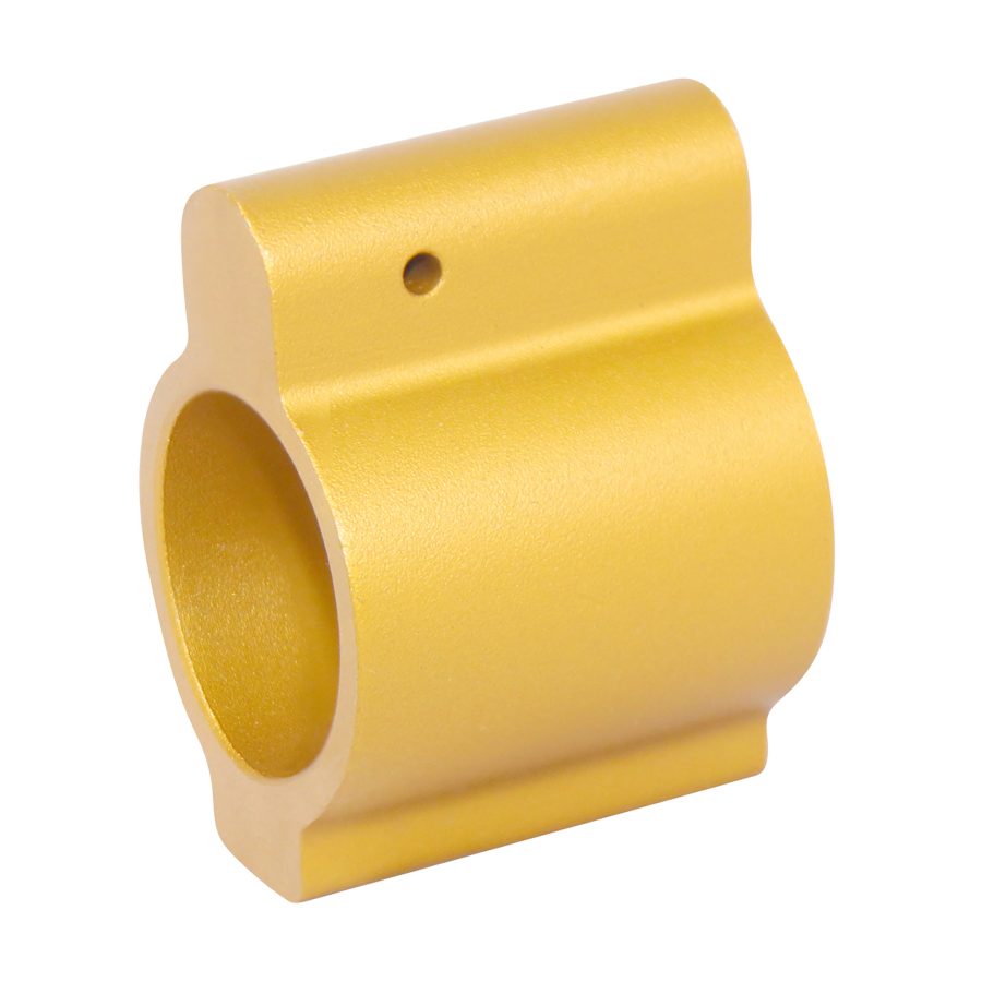 Gold anodized firearm gas block, precision-machined, featuring cylindrical hollow center and set screw hole.