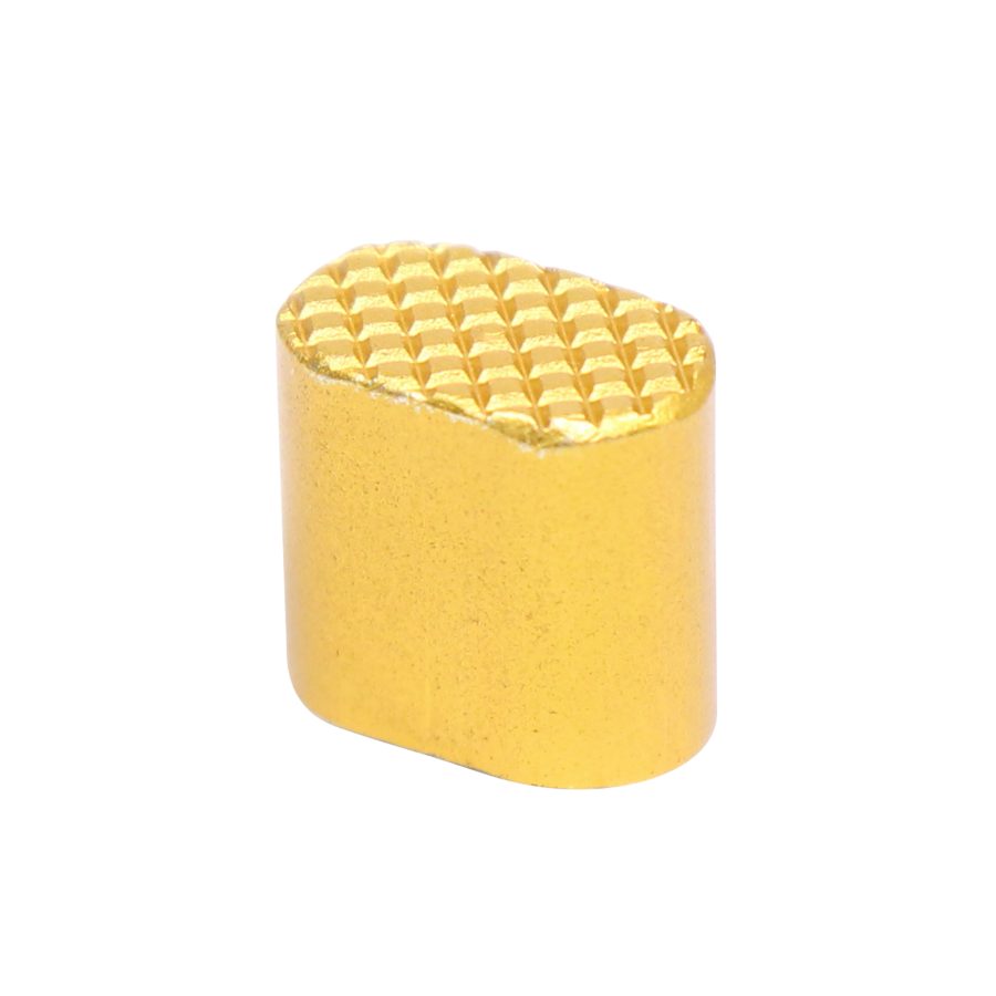 Gold oval object with waffle texture, decorative or functional piece against white background.