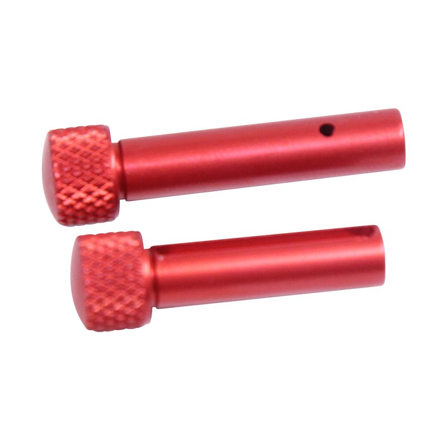 Red aluminum extended takedown pins enhance AR-15 rifles grip and functionality.