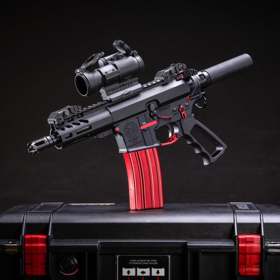 Matte Black AR-15 with Red Accents: Compact Design with Tactical Accessories.