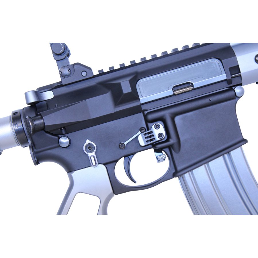Close-up of AR rifles receiver, showcasing tactical features and sleek matte black design.