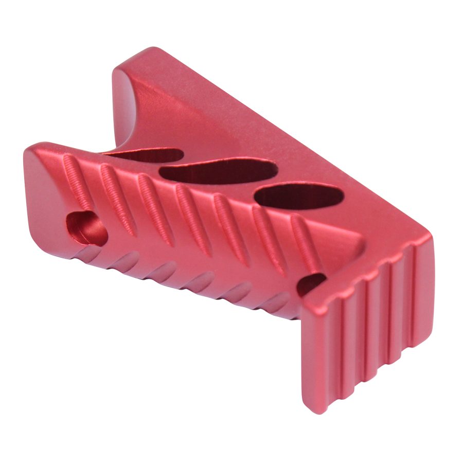 Red anodized aluminum firearm accessory with triangular design, enhancing weapon functionality and aesthetics.