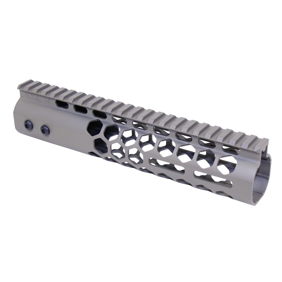 Silver AR-15 handguard with hexagonal cutouts and Picatinny rail for mounting accessories.