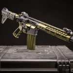 Modern AR-15 rifle in camouflage finish displayed on tactical case for marketing purposes.