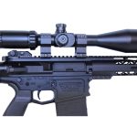 Modern tactical rifle with high-magnification scope on white background.