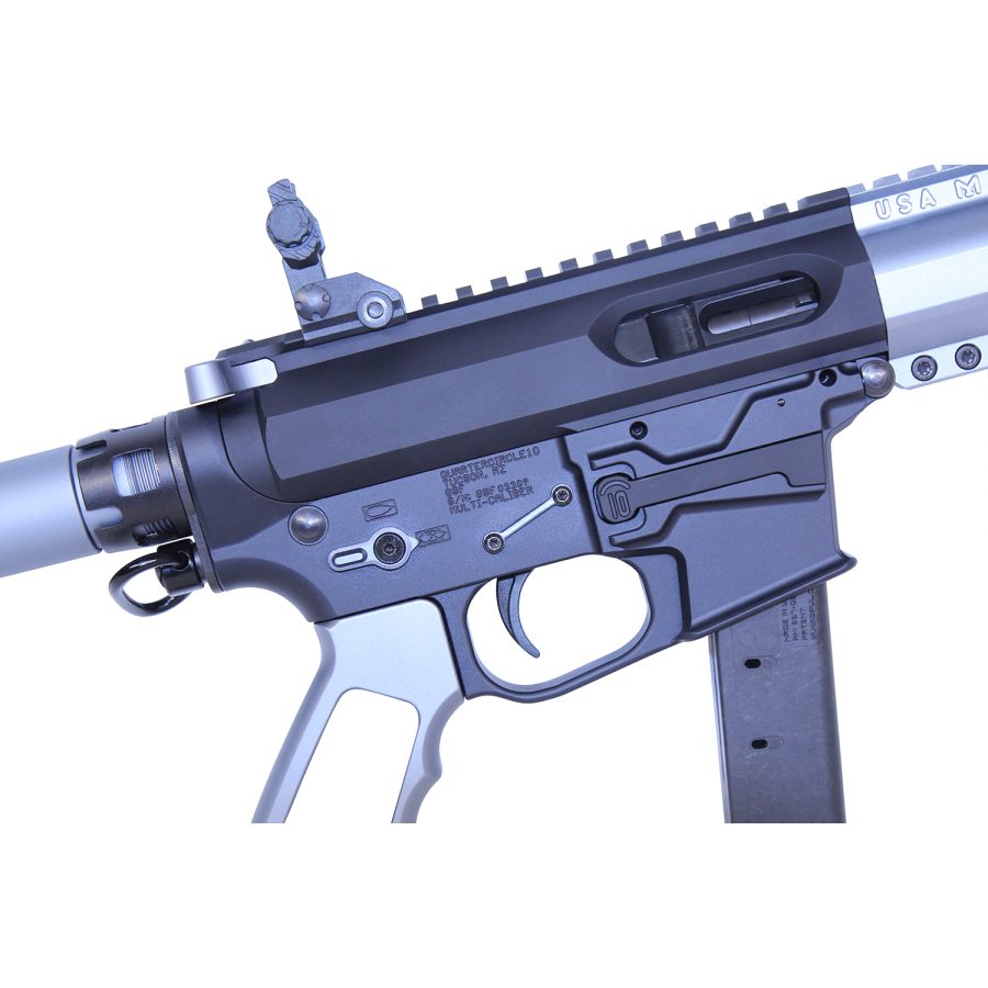 Close-up of modern semi-automatic firearm with tactical rail, ergonomic grip, and modular design.
