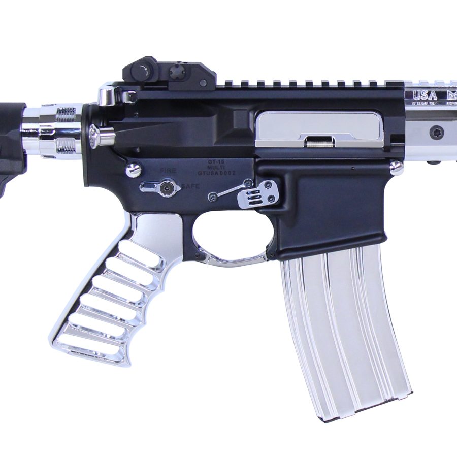 Close-up of two-tone AR-15 receiver with chrome accents and silver magazine.