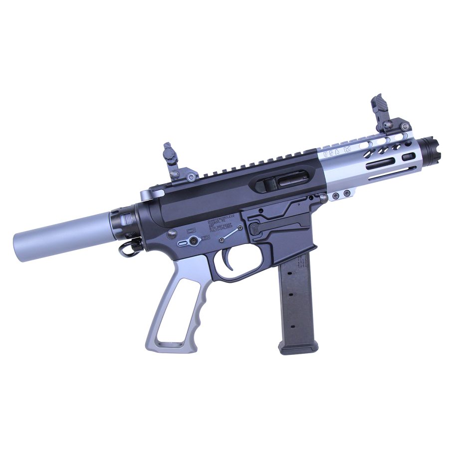 Compact two-tone AR-style pistol with suppressor, ergonomic grip, and accessory rail system.