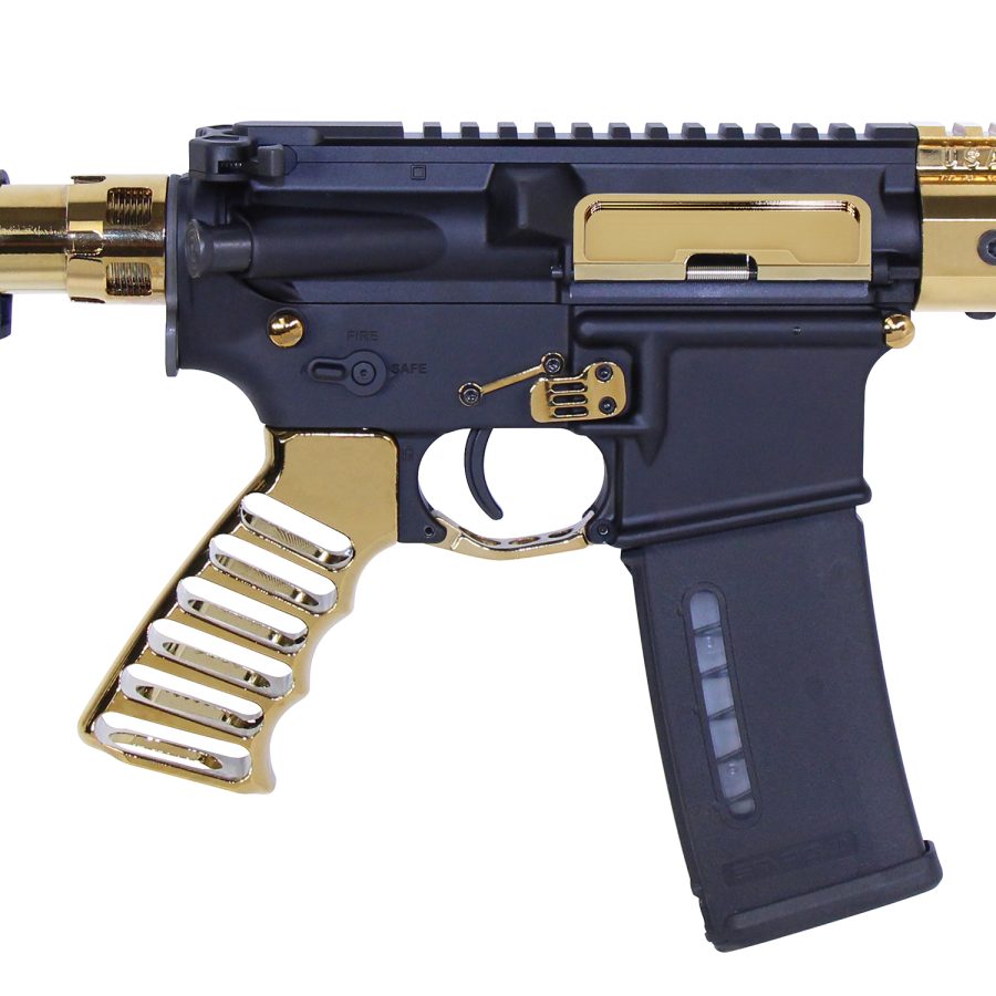 Custom two-tone AR-style firearm with gold accents, Picatinny rail, and black polymer magazine.