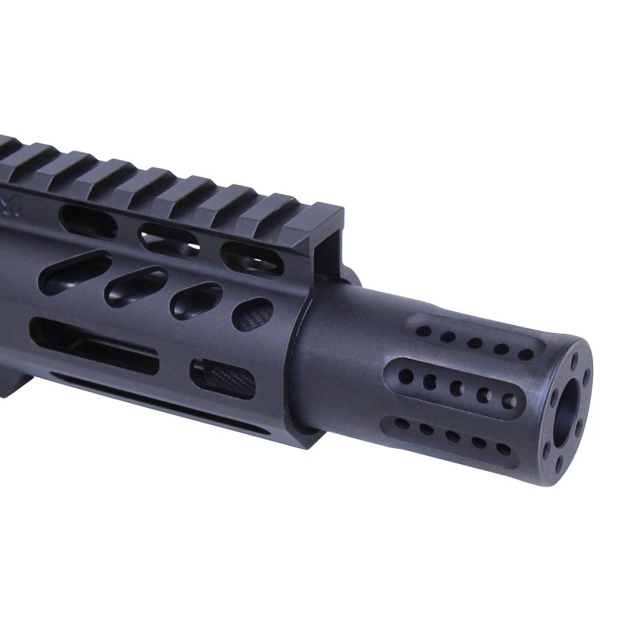 Close-up of a tactical firearm barrel with muzzle device and Picatinny rail on ventilated handguard.