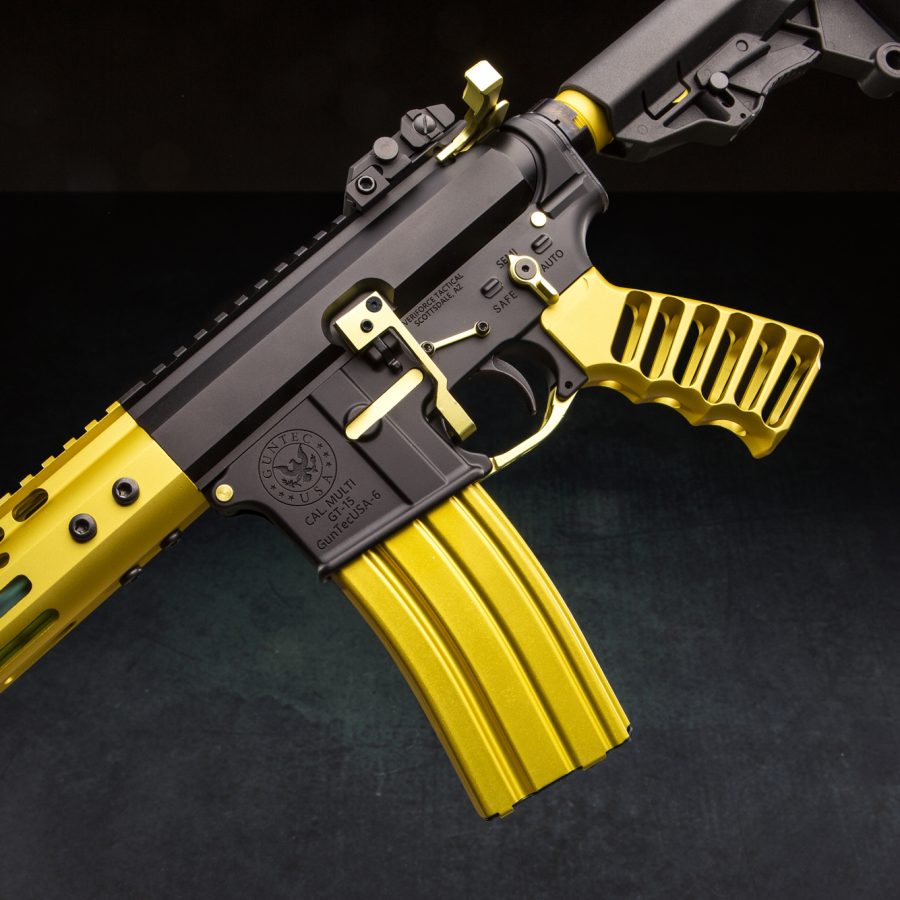 Custom black and yellow assault rifle with tactical features and vibrant design.