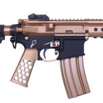Close-up of a black and copper modern assault rifle with optics and magazine.