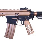 Two-tone Anderson AR-15 rifle: black lower, copper/bronze upper, tactical features.