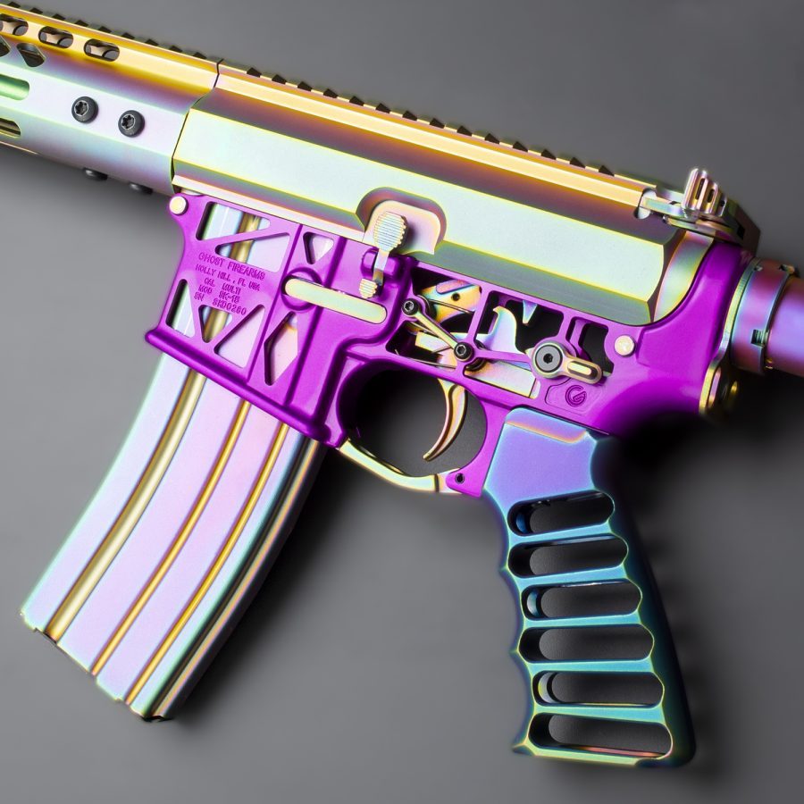 Colorful modern sporting rifle with iridescent finish, showcasing unique, artistic firearm customization.